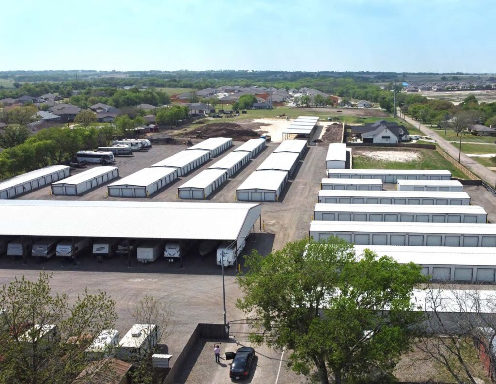 Main building with drive-up storage units and covered vehicle parking